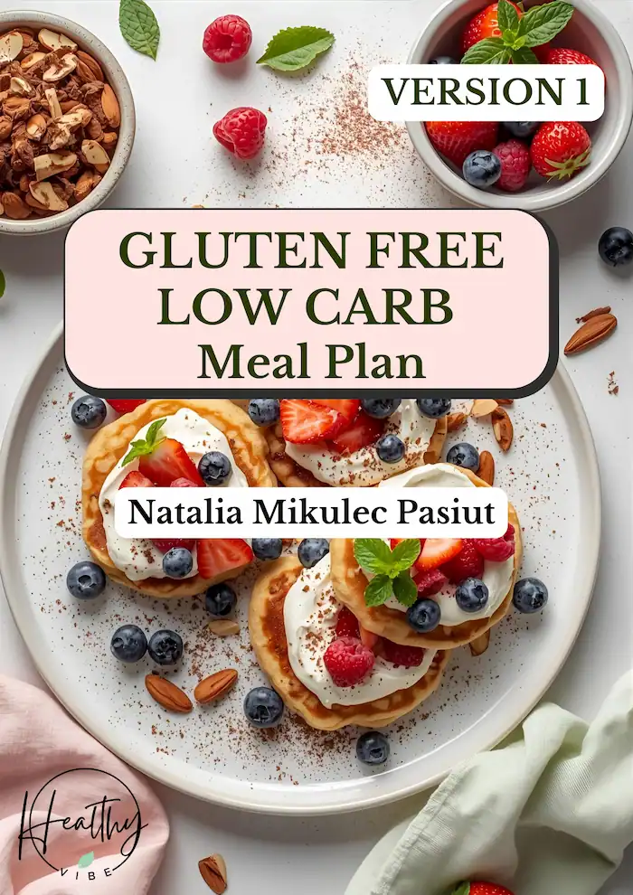 A cover page of a gluten free low carb online diet for reduction and health goals. There is a low carb mal on the picture - low carb pancakes with berries and cream . This meal looks healthy tasty and satisfying. There is a title "gluten free low carb meal plan" and the author name : natalia mikulec pasiut